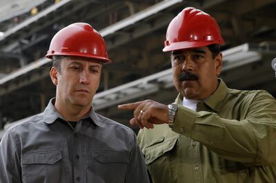Venezuela's President Nicolas Maduro and Vice President Tareck El Aissami, tour La Rinconada baseball stadium that is under construction, on the outskirts of Caracas, Venezuela, Saturday, May 19, 2018. Maduro is seeking a new six-year mandate â€” and despite crippling hyperinflation and widespread shortages of food and medicine, he is widely expected to win Sunday's election. (AP Photo/Ricardo Mazalan)
