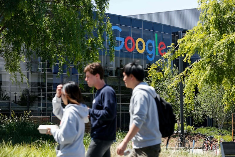 People walk in Google's main campus in Mountain View, California. The company has committed to running all of its campuses and data centres on carbon-free energy by 2030. AFP