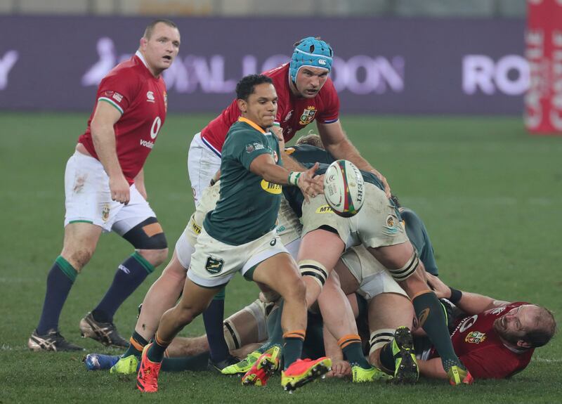 South Africa's Hershel Jantjies goes to kick the ball clear.