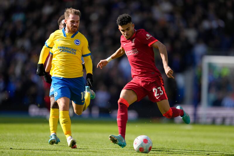 Liverpool attacker Luis Diaz under pressure from Brighton's Alexis Mac Allister. AP
