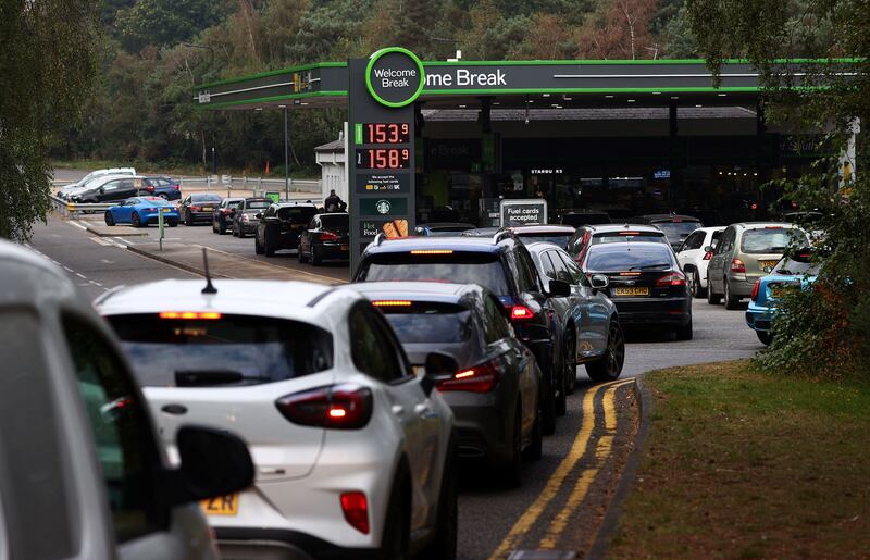 Motorists queue for petrol at a station off of the M3 motorway near Fleet, west of London. Photo: AFP