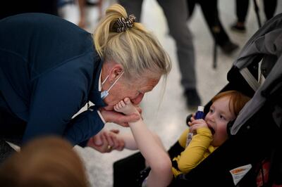 Family members reunite at Sydney's airport. AFP