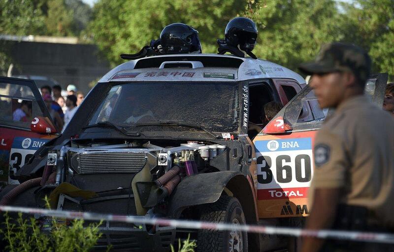 Chinese driver Meiling Guo remains inside her Mini after she ran into the crowd during the 11km prologue of the 2016 Dakar Rally. Franck Fife / AFP 

