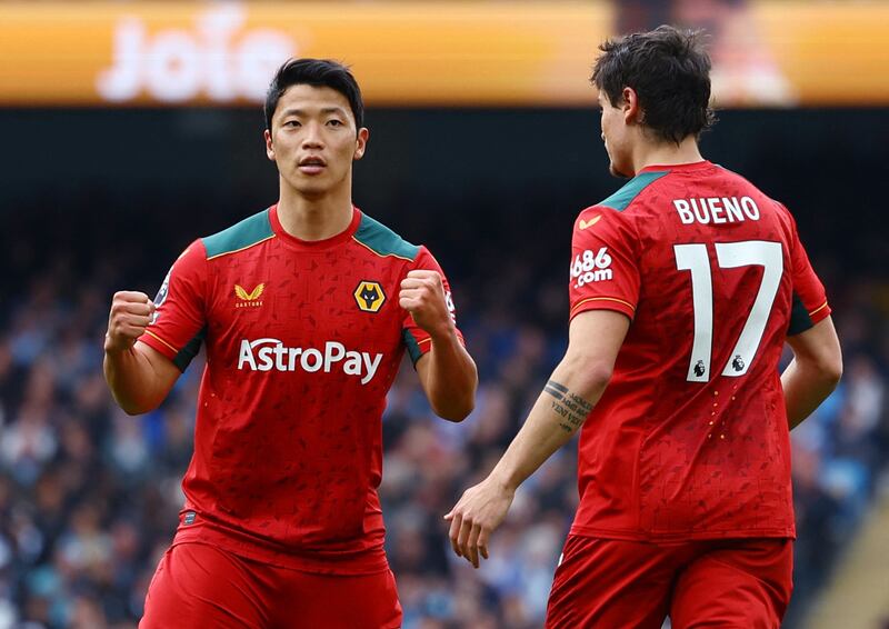 Wolverhampton Wanderers' Hwang Hee-chan celebrates scoring their first goal with Hugo Bueno. Reuters