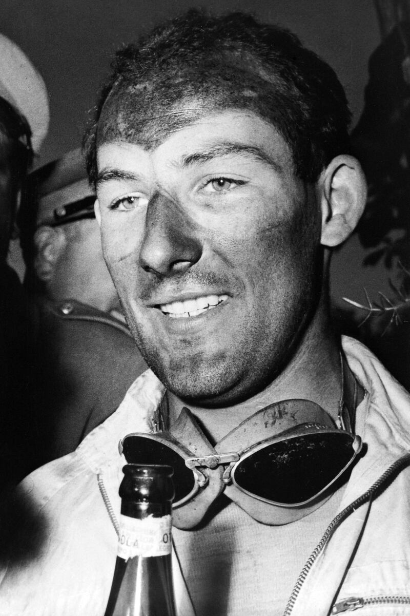 Stirling Moss after winning the Mille Miglia endurance race in Brescia, Italy, on May 1, 1955. Moss has died following a long illness. AFP