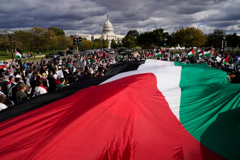 People march near the US Capitol during a pro-Palestinian march calling for a ceasefire in Gaza, on October 21, in Washington. AP