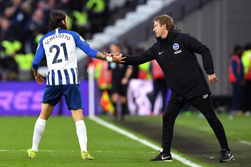 LONDON, ENGLAND - FEBRUARY 01: Matias Ezequiel Schelotto of Brighton & Hove Albion celebrates with Graham Potter, Manager of Brighton & Hove Albion after the 2nd Brighton goal during the Premier League match between West Ham United and Brighton & Hove Albion at London Stadium on February 01, 2020 in London, United Kingdom. (Photo by Justin Setterfield/Getty Images)
