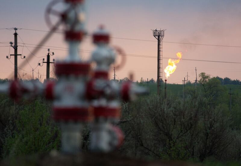 A flare stack burns beyond oil control valves in an oil field near Samara, Russia, on Tuesday, May 14, 2019. The nearby village of Nikolayevka in central Russia has emerged as the epicenter of an international oil scandal with authorities saying corrosive chlorides entered Russia’s 40,000-mile network of oil pipelines, causing the first-ever shutdown of the main export artery to Europe. Photographer: Andrey Rudakov/Bloomberg