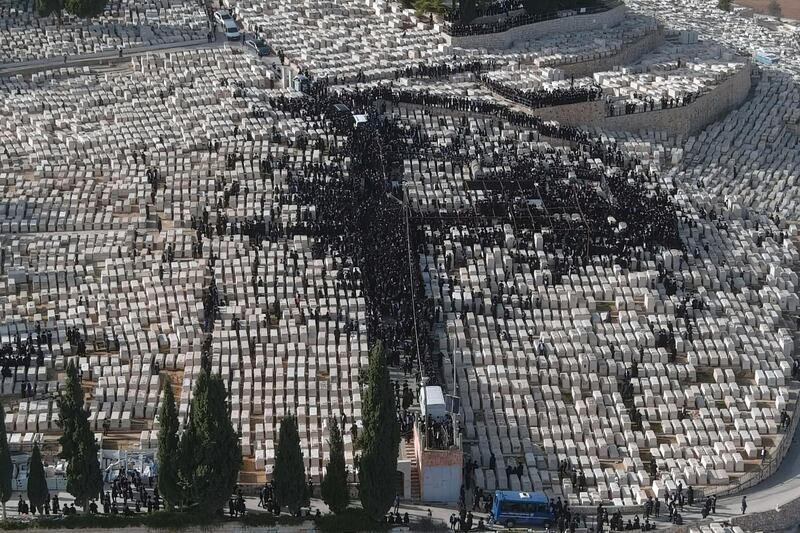 An aerial view shows ultra-Orthodox Jews taking part in the funeral of Rabbi Meshulam Dovid Soloveitchik amid coronavirus restrictions in a cemetery in Jerusalem. Reuters