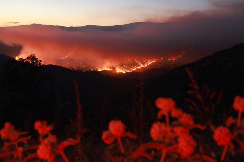 Embers glow at night as the Basin Fire burns in the Sierra National Forest in Fresno County, California. AFP