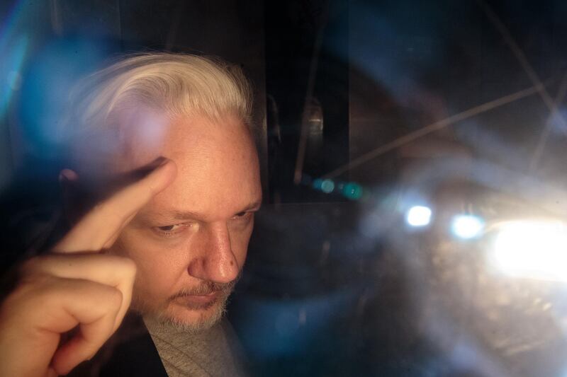***BESTPIX*** LONDON, ENGLAND - MAY 01: Wikileaks Founder Julian Assange leaves Southwark Crown Court in a security van after being sentenced on May 1, 2019 in London, England. Wikileaks Founder Julian Assange, 47, was sentenced to 50 weeks in prison for breaching his bail conditions when he took refuge in the Ecuadorian Embassy in 2012 to avoid extradition to Sweden over sexual assault allegations, charges he denies. The UK will now decide whether to extradite him to US to face conspiracy charges after his whistle-blowing website Wikileaks published classified US documents. (Photo by Jack Taylor/Getty Images)