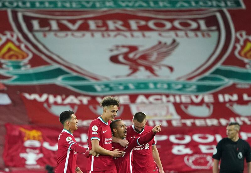 Soccer Football - Premier League - Liverpool v Southampton - Anfield, Liverpool, Britain - May 8, 2021 Liverpool's Thiago Alcantara celebrates scoring their second goal with teammates Pool via REUTERS/Zac Goodwin EDITORIAL USE ONLY. No use with unauthorized audio, video, data, fixture lists, club/league logos or 'live' services. Online in-match use limited to 75 images, no video emulation. No use in betting, games or single club /league/player publications.  Please contact your account representative for further details.