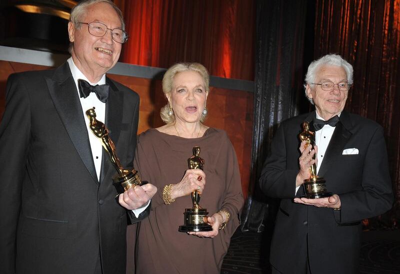 Lauren Bacall, producer-director Roger Corman and cinematographer Roger Willis with their awards at the Academy of Motion Picture Arts and Sciences inaugural Governors Awards at the Grand Ballroom at Hollywood & Highland Center in Hollywood, California. AFP