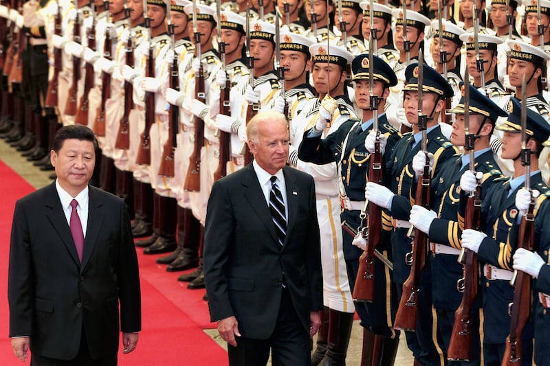 The pair inspect the honour guard at Great Hall of the People, Beijing, in 2011, part of Mr Biden's official visit to China. Getty