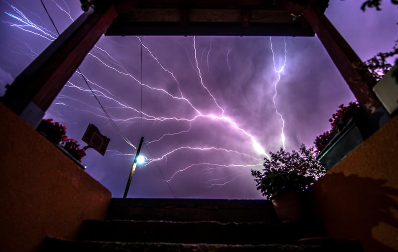 A lightning bolt strikes across the sky as a thunderstorm passes over the village of Bardovci near Skopje in the  Republic of Macedonia. Saso Licovski / EPA