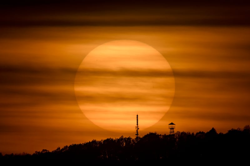 The Sun sets behind Mount Karancs near Salgotarjan, northern Hungary. EPA