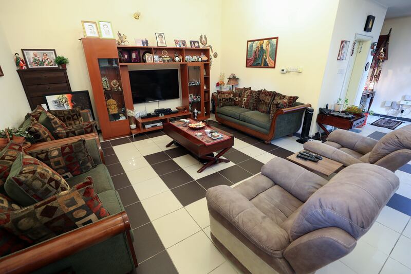 The spacious living room has a brown colour scheme and is the couple's favourite space in which to hang out.  