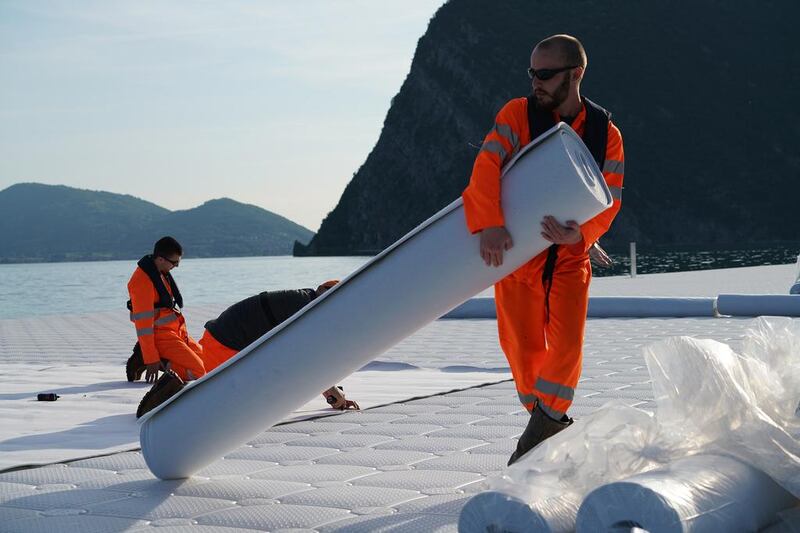 Workers install the felt that will cover the floating cubes before the yellow fabric is installed, May 2016 Photo: Wolfgang Volz