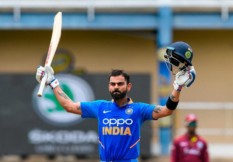 Virat Kohli of India celebrates his century (100 runs) during the 2nd ODI match between West Indies and India at Queens Park Oval in Port of Spain, Trinidad and Tobago, on August 11, 2019. / AFP / Randy Brooks
