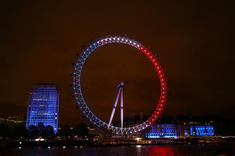 The London Eye illuminated in the colours of the French national flag on November 14, 2015, as Britons express their solidarity with France following a spate of coordinated attacks that left nearly 130 dead in Paris a day earlier. Justin Tallis/AFP Photo