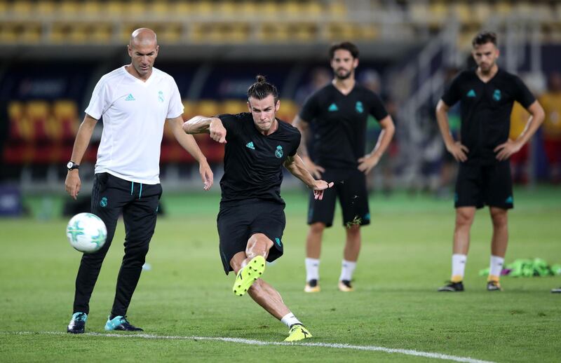 Real Madrid's Gareth Bale is watched by manager Zinedine Zidane during the training session at the Philip II Arena, Skopje, Macedonia. PRESS ASSOCIATION Photo. Picture date: Monday August 7, 2017. Real Madrid face Manchester United in the Super Cup tomorrow night. See PA story SOCCER Real Madrid. Photo credit should read: Nick Potts/PA Wire. RESTRICTIONS: Editorial use only, No commercial use without prior permission.