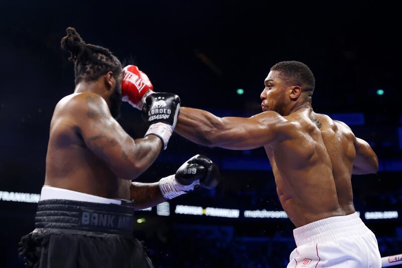 Anthony Joshua punches Jermaine Franklin during the Heavyweight fight between Anthony Joshua and Jermaine Franklin at The O2 Arena. G0etty Images