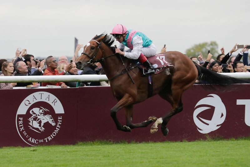 (FILES) This file photograph taken on October 1, 2017, shows Italian jockey Frankie Dettori, as he rides the horse 'Enable', owned by Prince Khalid Abdullah, to victory in the 96th Qatar Prix de l'Arc de Triomphe horse race at Chantilly Racecourse, north of Paris. 'Enable' trained by John Gosden will attempt on October 6, 2019,  to win the Qatar Prix de l'Arc de Triomphe for the third year in a row at the Paris-Longchamp racecourse, a success that no thoroughbred has yet achieved. / AFP / THOMAS SAMSON
