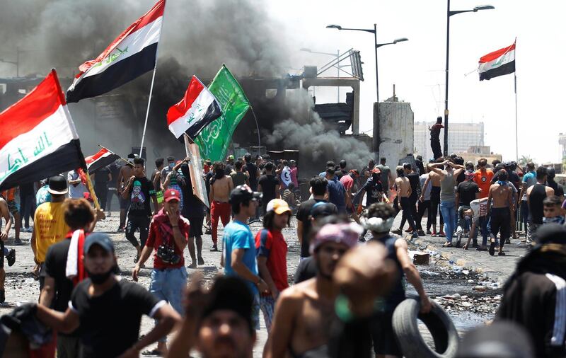 Demonstrators gesture as they take part in the ongoing anti-government protests after newly-appointed Iraqi Prime Minister Mustafa Kadhimi called for the release of all deatined protesters, at Al Jumhuriya bridge in Baghdad, Iraq. REUTERS