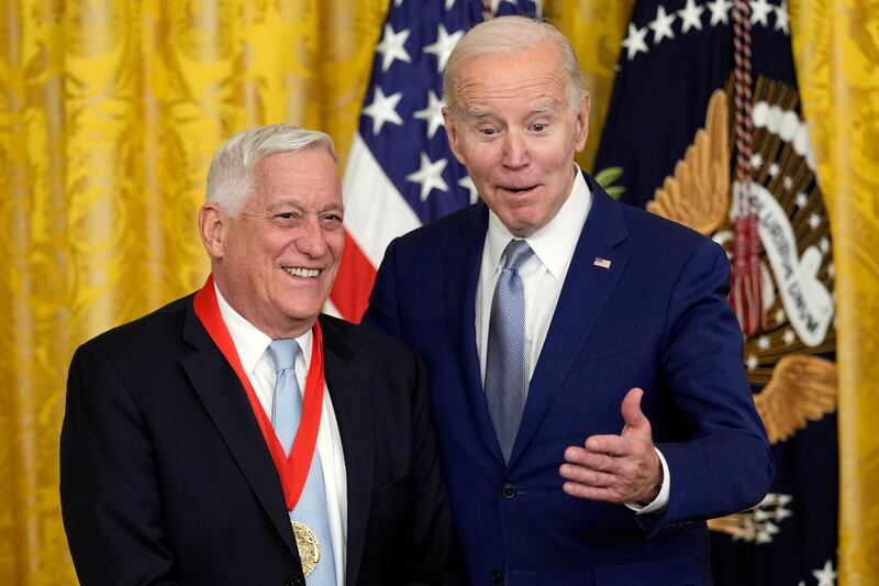 Mr Biden presents the 2021 National Humanities Medal to Walter Isaacson. AP