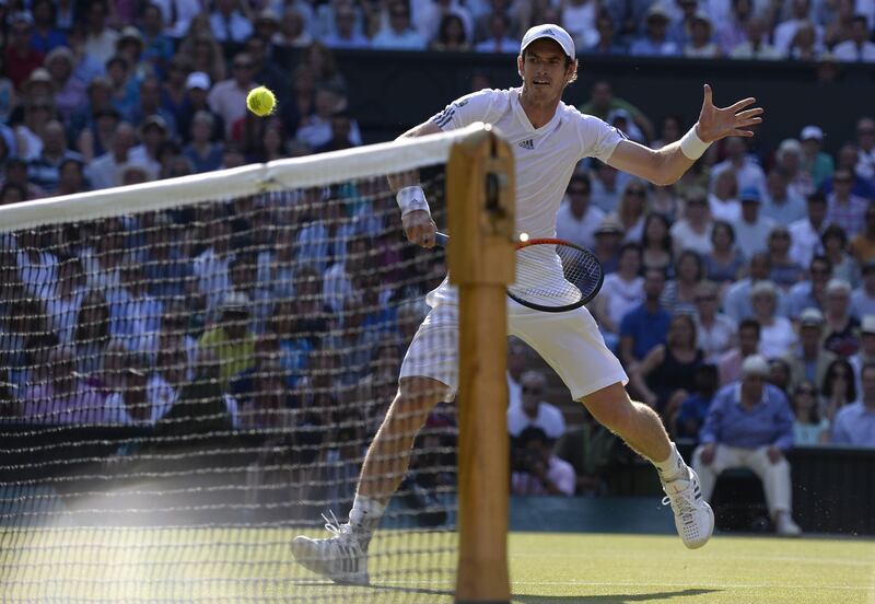 Serbia's Novak Djokovic returns against Britain's Andy Murray during the men's singles final on day thirteen of the 2013 Wimbledon Championships tennis tournament at the All England Club in Wimbledon, southwest London, on July 7, 2013. AFP PHOTO / ADRIAN DENNIS - RESTRICTED TO EDITORIAL USE
 *** Local Caption ***  509933-01-08.jpg