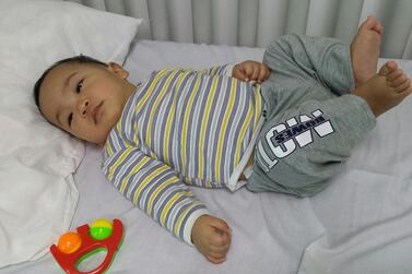 Universal Hospital in Abu Dhabi has looked after a baby they named Sebastian for the past nine months since his Filipina mother abandoned him and fled the country. Anwar Ahmad / The National