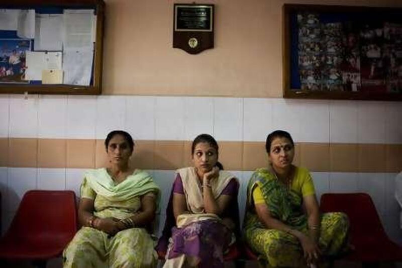 Pregant women and their relatives wait to see Dr. Nayana Patel in her clinic in Anand, Gujarat, India.