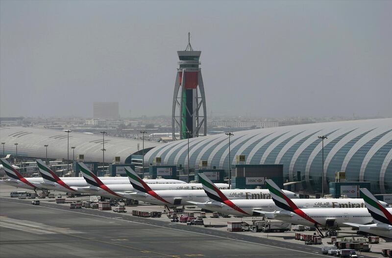 FILE - In this April 20, 2017 file photo, Emirates planes are parked at the Dubai International Airport in Dubai, United Arab Emirates. The airport said Monday, Jan. 28, 2019, that it remains the world's busiest for international travel and that it welcomed over 89 million passengers in 2018. (AP Photo/Kamran Jebreili, File)