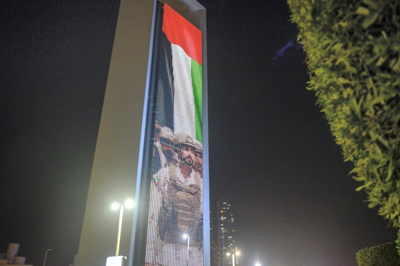 Abu Dhabi, United Arab Emirates - ADNOC building projected with the image of Sheikh Zayed Bin Hamdan on February 17, 2018. (Khushnum Bhandari/ The National)
