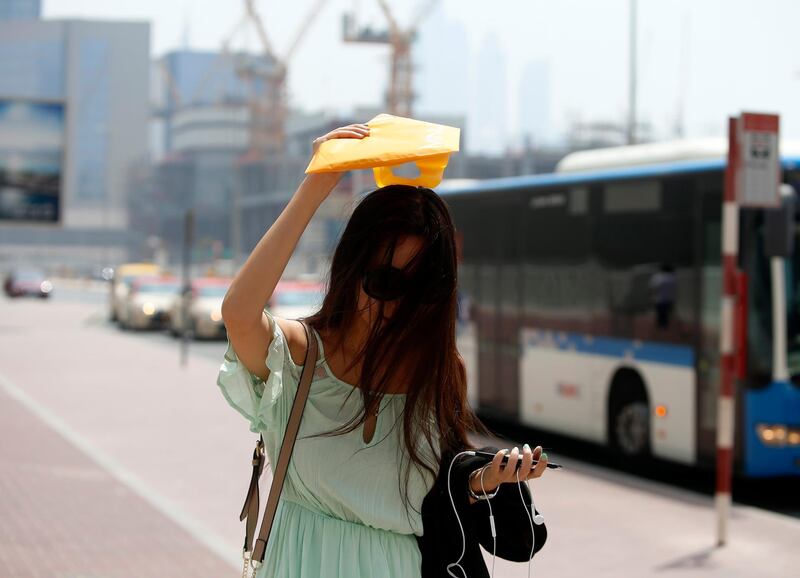 Dubai, United Arab Emirates, June 29, 2017: People in Dubai show various ways to keep cool and stay out of the sun. Thursday, June. 29, 2017, in Dubai. Chris Whiteoak for The National *** Local Caption ***  CW_2906_HotWeather_17.JPG