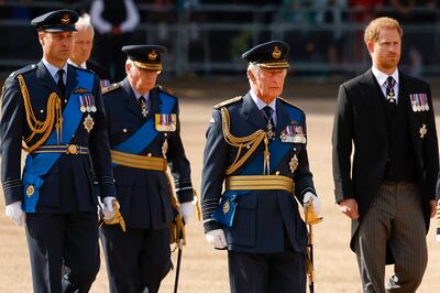 Prince William, King Charles III and Prince Harry walk behind the coffin during the procession for the lying-in state of Queen Elizabeth II. Getty
