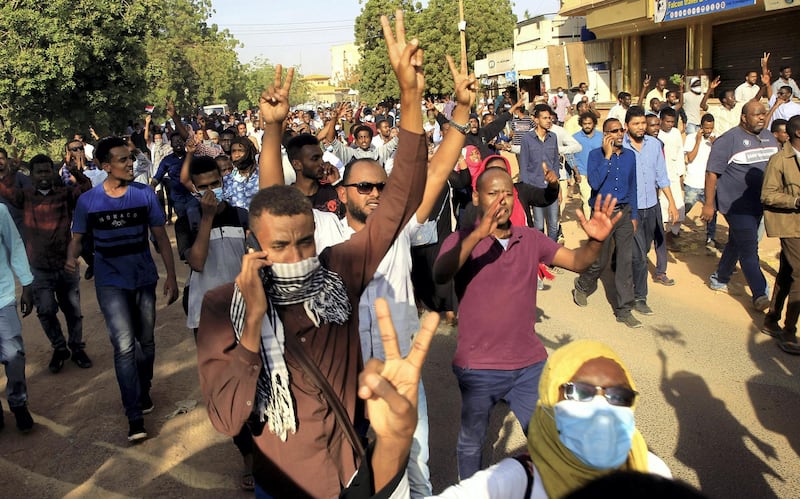 Sudanese demonstrators chant slogans as they march along the street during anti-government protests in Khartoum, Sudan December 25, 2018. REUTERS/Mohamed Nureldin Abdallah