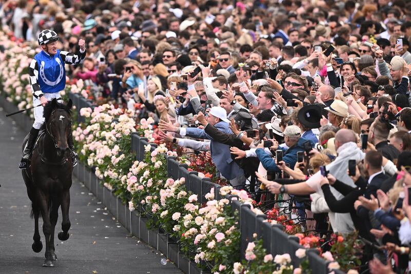 Jockey Mark Zahra riding Gold Trip celebrates after winning  the Melbourne Cup. EPA