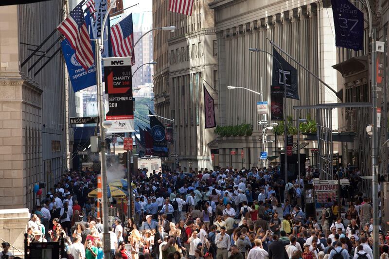 NEW YORK, NY - AUGUST 23: Crowds stand on Wall Street after a 5.9 earthquake struck on August 23, 2011 in New York, United States. The epicenter of the 5.9 earthquake was located near Louisa in central Virginia. Two nuclear power plants at the North Anna Power Station in the same county were reportedly taken offline.   Andrew Burton/Getty Images/AFP== FOR NEWSPAPERS, INTERNET, TELCOS & TELEVISION USE ONLY ==
 *** Local Caption ***  666348-01-09.jpg