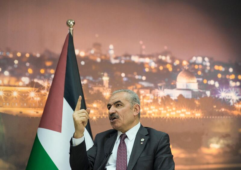 Palestinian Prime Minister Mohammad Shtayyeh italks during an interview with The Associated Press, at his office in the West Bank city of Ramallah, Tuesday, April 16, 2019. Stayyeh accused the United States of declaring "financial war" on his people and said an American peace plan purported to be in the works will be "born dead." (AP Photo/Nasser Nasser)