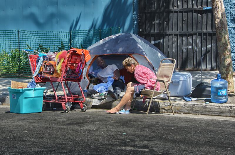 This couple calls Skid Row in Los Angeles their home. Photo: Russ Allison Loar