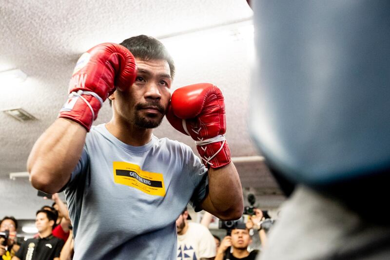 Manny Pacquiao's professional boxing record stands at record stands at 61-7-2, with 39 knockouts. EPA