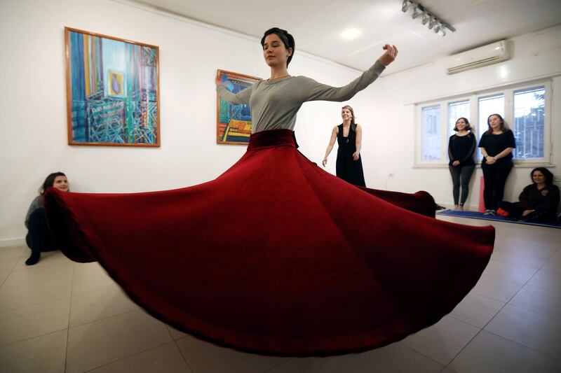 A student spins during the “Wonders of Whirling” workshop of the whirling dervish dance, a form of physically active meditation practiced by Sufis in Amman, Jordan. Reuters