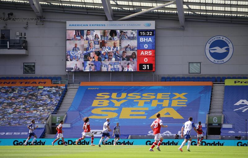 Brighton & Hove Albion's fans on the big screen at the American Express Community Stadium. Reuters