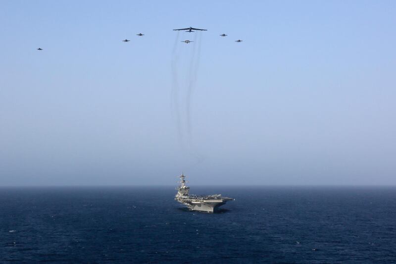 The Abraham Lincoln Carrier Strike Group and a US Air Force B-52H Stratofortress, assigned to the 20th Expeditionary Bomb Squadron and part of the Bomber Task Force deployed to the region, conducting joint exercises in the US Central Command area of responsibility, in the Arabian Sea.  EPA