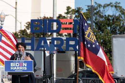 ATLANTA, GA - NOVEMBER 02: Voting right activist and politician Stacey Abrams speaks to the crowd during a Drive-in Mobilization Rally to get out the vote on November 2, 2020 in Atlanta, Georgia. Republican Sens. David Perdue and Kelly Loeffler are locked in a tight battle with Democrats Jon Ossoff and Raphael Warnock for the Senate seats in Georgia.   Jessica McGowan/Getty Images/AFP
== FOR NEWSPAPERS, INTERNET, TELCOS & TELEVISION USE ONLY ==
