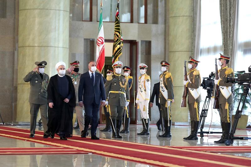 Iraqi Prime Minister Mustafa Al Kadhimi reviews an honour guard as he is welcomed by President Hassan Rouhani. AP