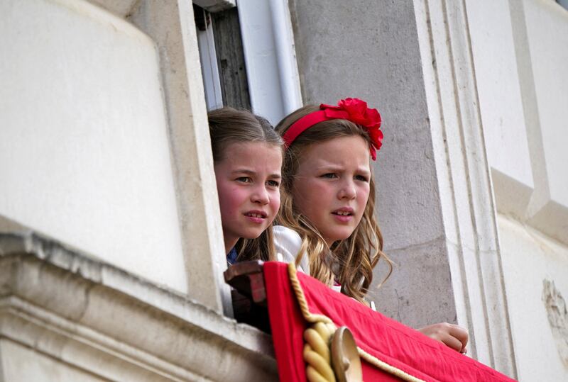 Britain's Princess Charlotte and Mia Grace Tindall watch the the Trooping the Colour in June 2022. Reuters