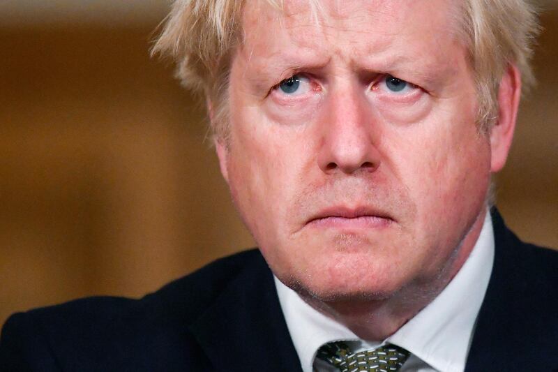 Britain's Prime Minister Boris Johnson looks on during a coronavirus briefing in Downing Street, London, Monday, Oct. 12, 2020. (Toby Melville/Pool Photo via AP)