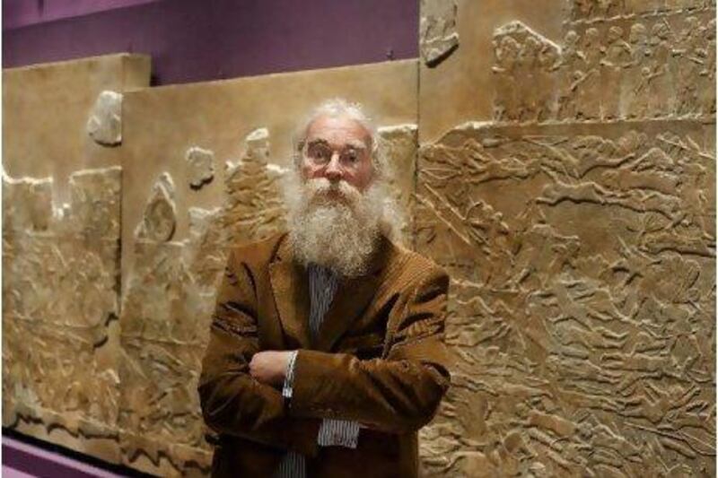 Dr Irving Finkel, the curator of the Middle East Department - the British Museum, with some of the artefacts featuring cuneiform: the oldest form of writing yet discovered.